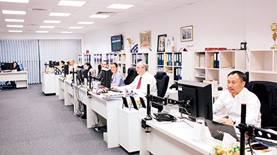 Alcedo's open and efficient office atmosphere with the president and employees seated side by side